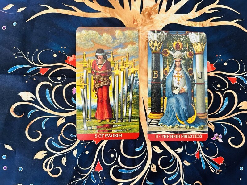 The Eight of Swords and The High Priestess photo by Tarot Institute