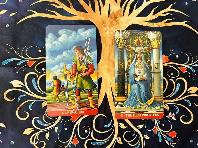 The Five of Swords and The High Priestess photo by Tarot Institute