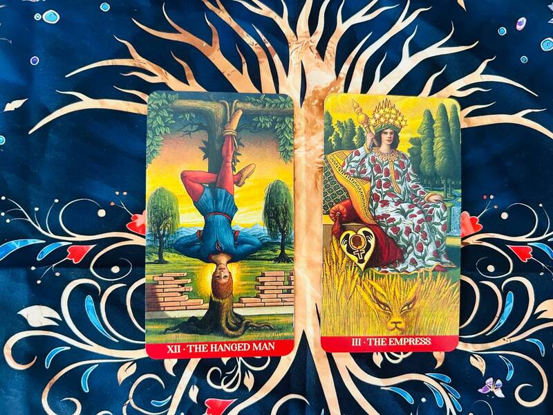 The Hanged Man and The Empress photo by Tarot Institute