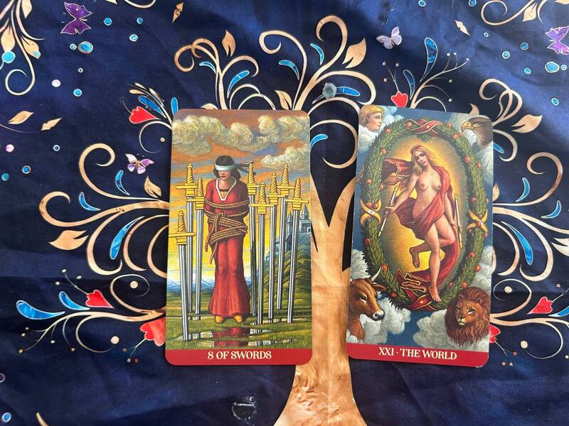 Eight of Swords and The World photo by Tarot Institute