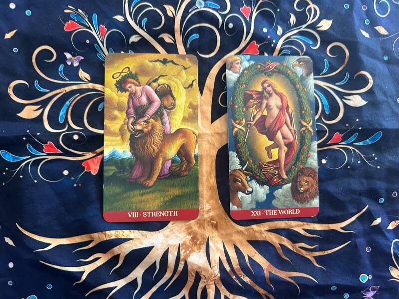 Strength and The World photo by Tarot Institute