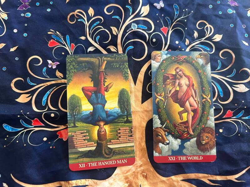 
The Hanged Man and The World photo by Tarot Institute